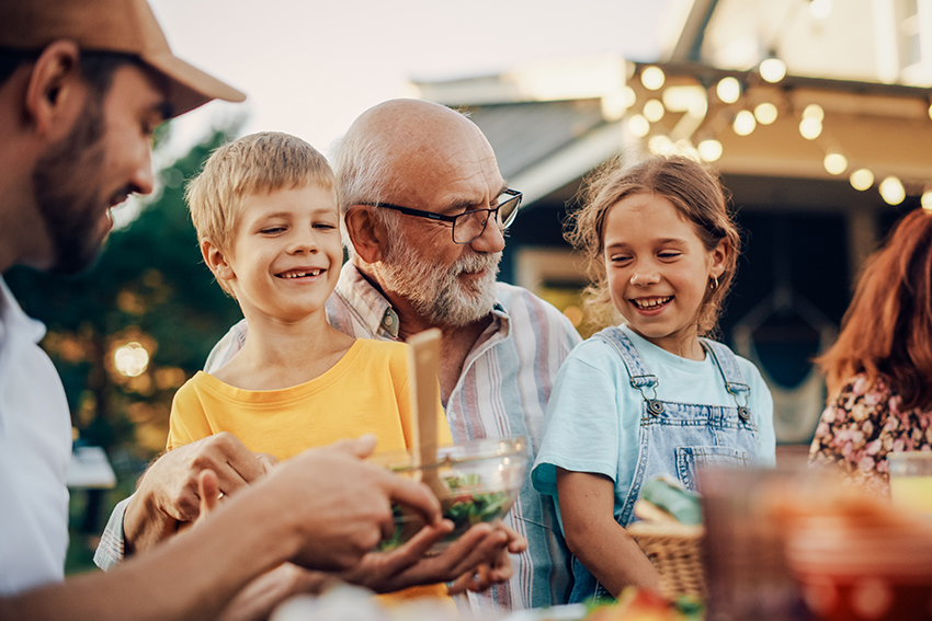 grandfather and grandkids at bbq